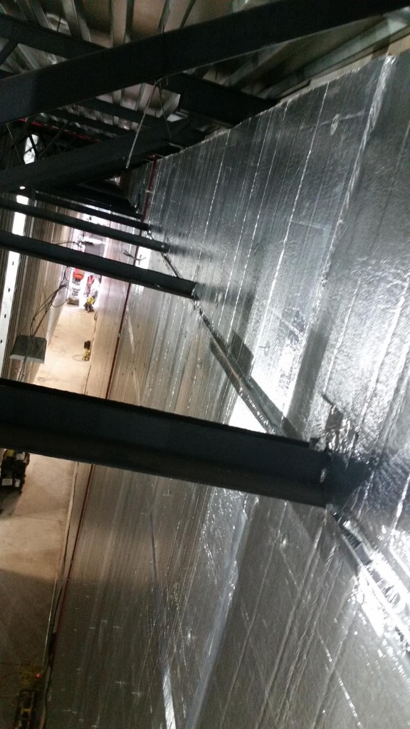 Large commercial interior with foil insulation and steel framing
